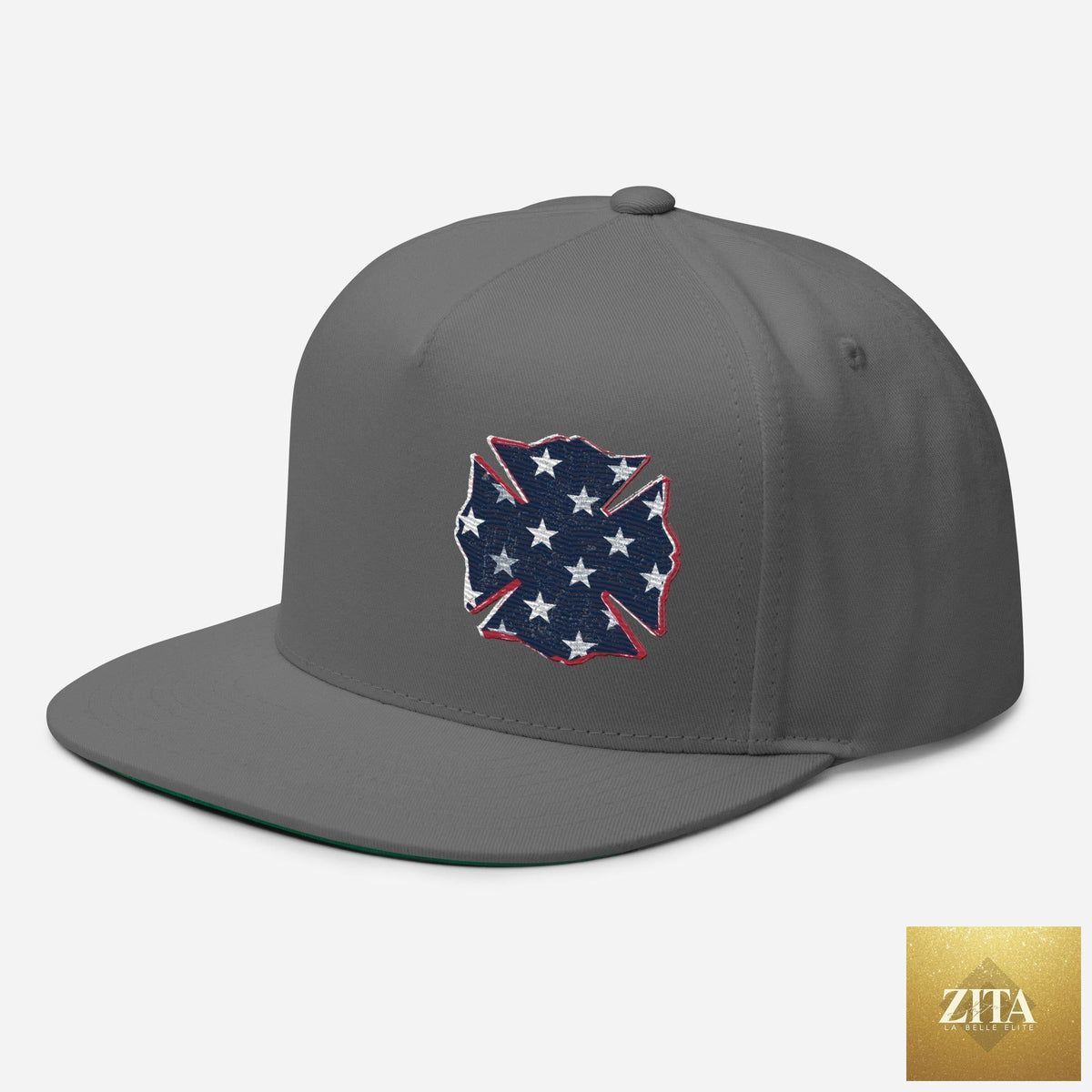 Gray Freedom Maltese flat bill hat by Zita La Belle Elite, shown from the front-left angle with a structured brim.