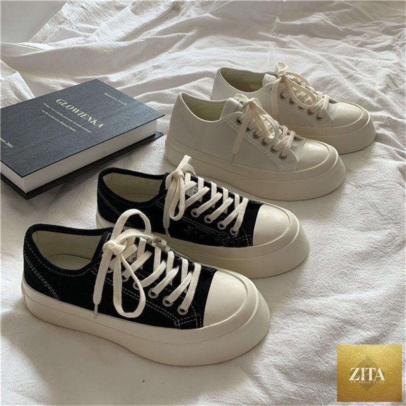 Stevvex women's white canvas sneakers with flat platform, casual athletic design, low-top round toe and breathable mesh details.