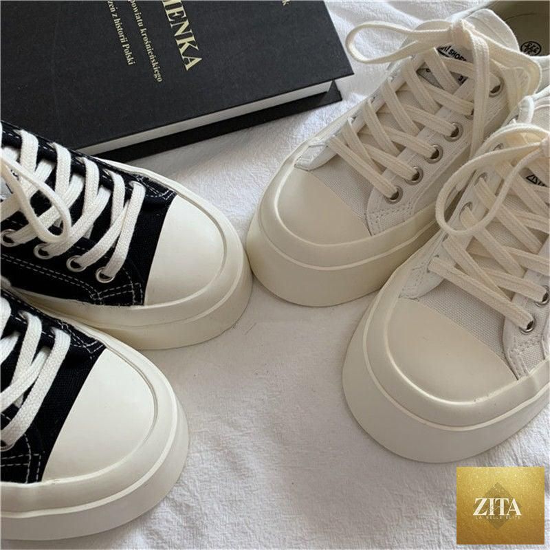 White Stevvex women's flat sneakers with platform and canvas design, low-top athletic shoes for casual and tennis-inspired wear.