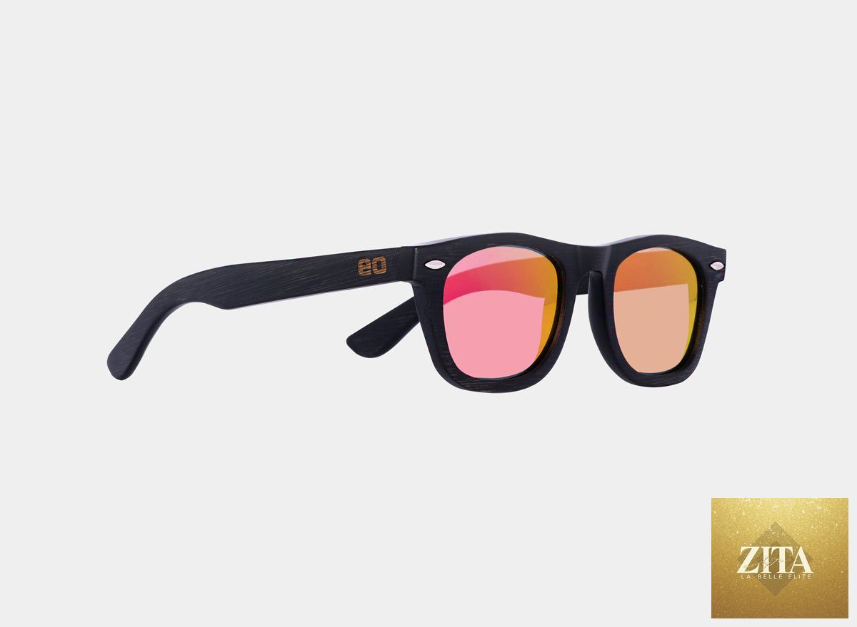 Black and pink bamboo floating sunglasses by Eastern Outer with sleek, lightweight design and polarized lenses.