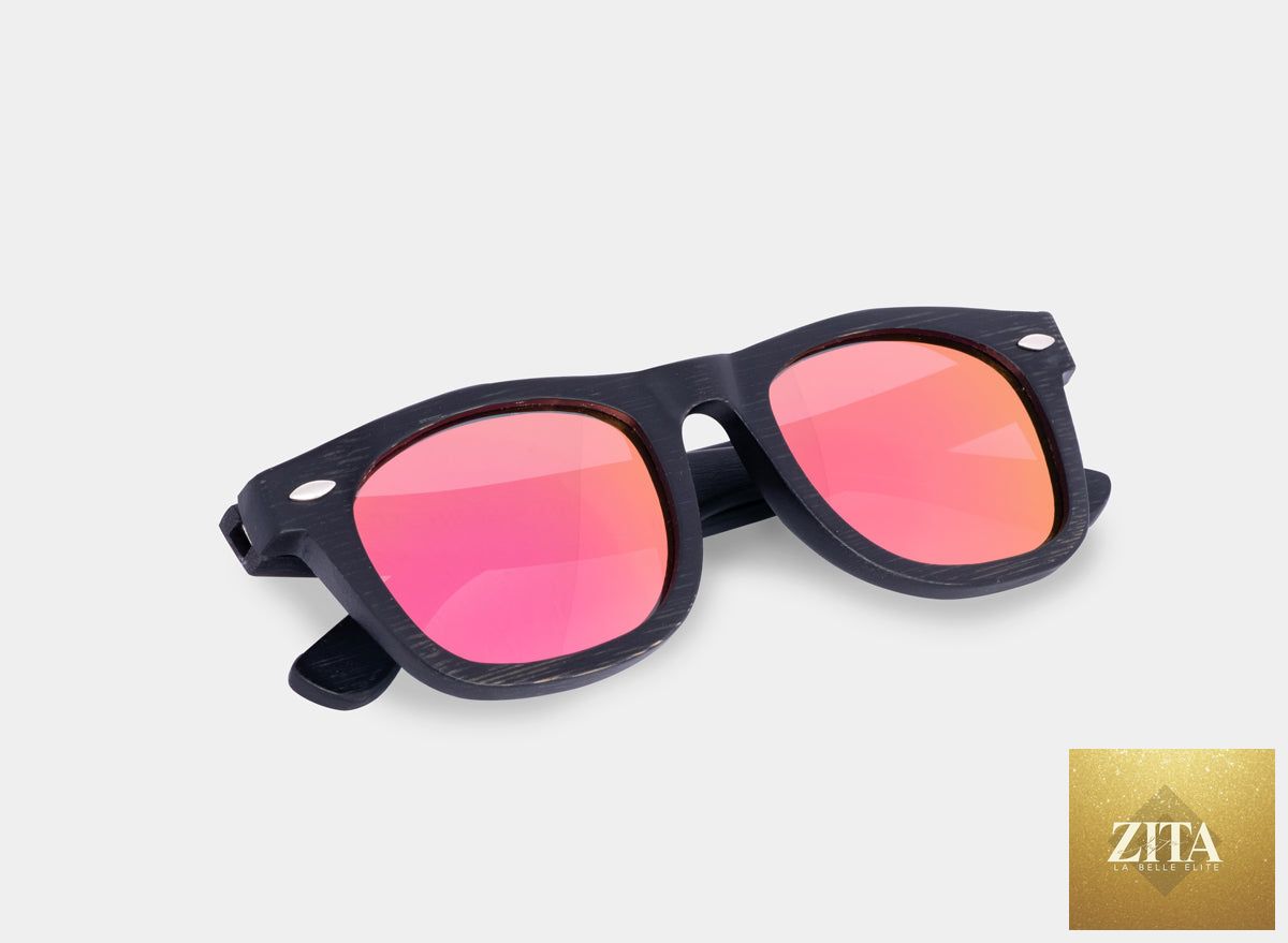 Black and pink bamboo floating sunglasses by Eastern Outer with sleek, lightweight design and stylish frame.