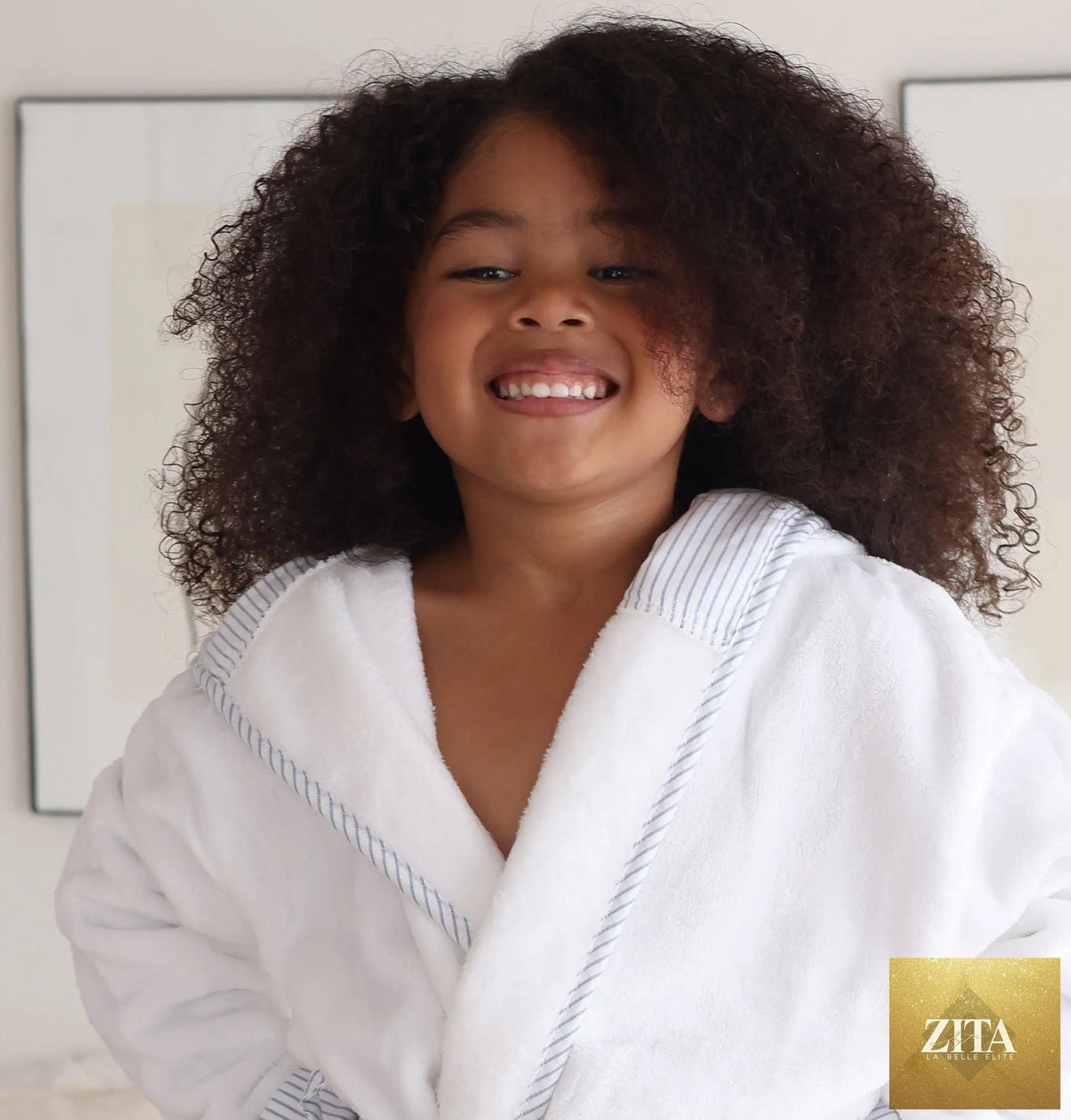 Small blue kids' plush robe from Lotus Linen, ultra soft, cozy, and safe for toddlers and children, shown from the front.