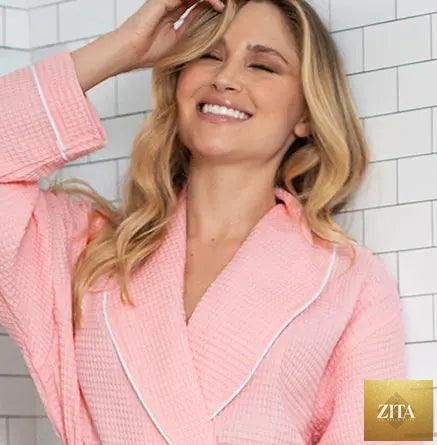 Front view of Lotus Linen women's blush waffle piping bathrobe, lightweight spa-style robe with piping detail, cozy and comfortable.