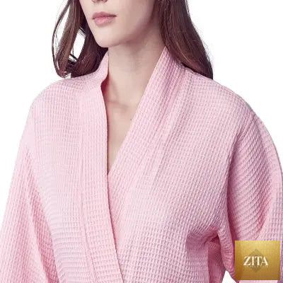 Front view of Lotus Linen women's knee-length waffle robe in blush, showcasing soft fabric and relaxed fit.