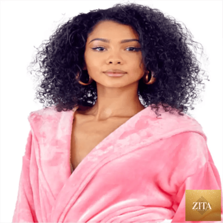 Pink plush hooded women’s robe from Lotus Linen, featuring a cozy front design and soft fabric for spa-like comfort at home.