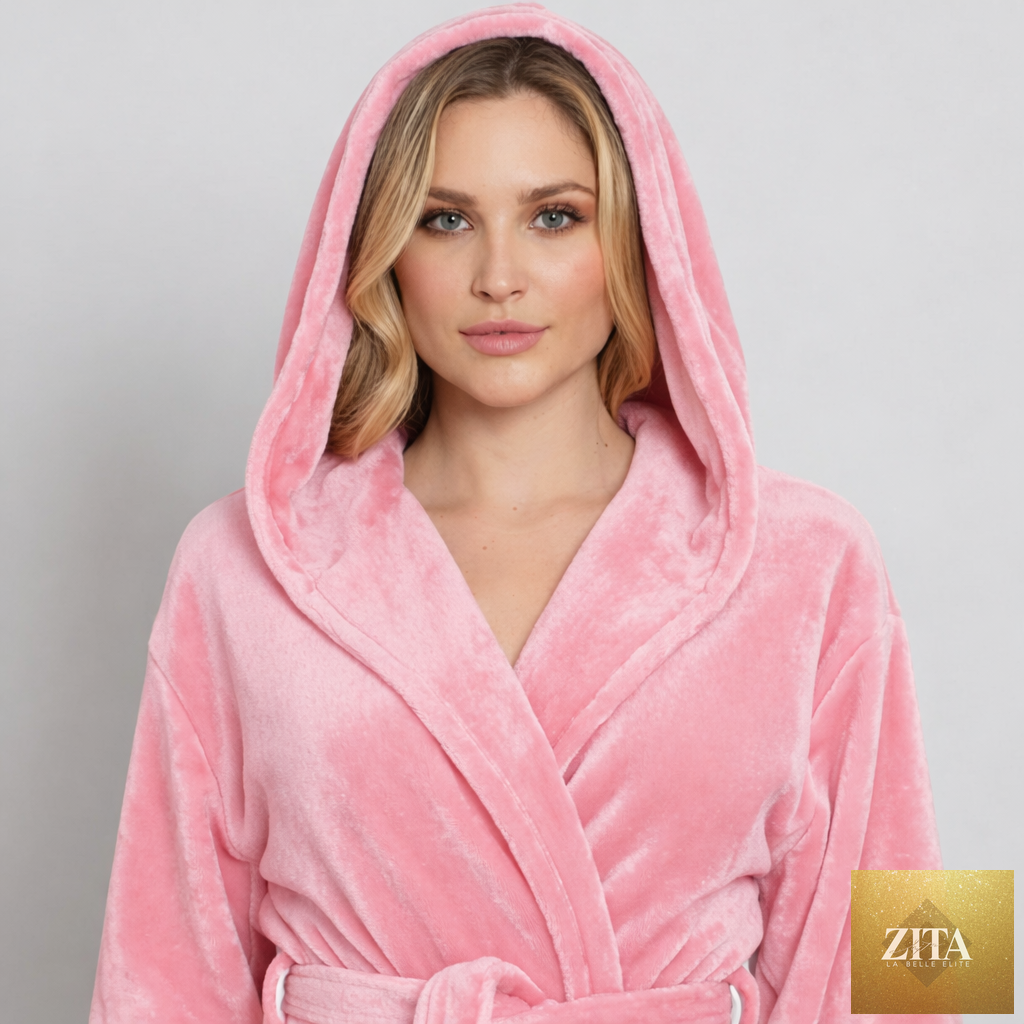 Pink plush hooded women's robe by Lotus Linen featuring front pockets and cozy, spa-inspired comfort at home.