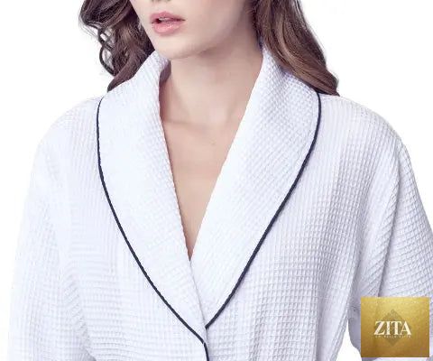 Front view of Lotus Linen women's knee-length waffle robe in small size, white with piping detail.