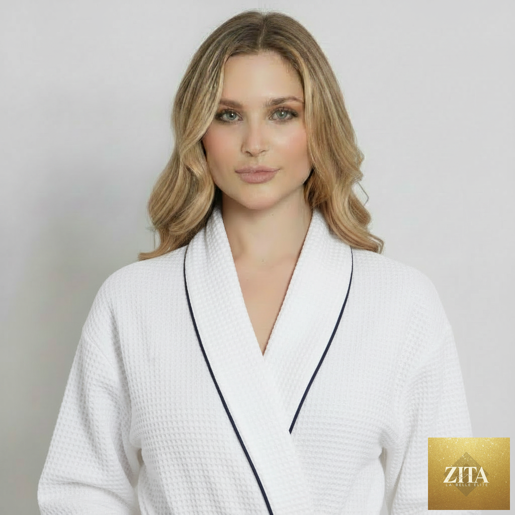 Front view of Lotus Linen women's knee-length white waffle robe with piping, showcasing a cozy, comfortable robe design.