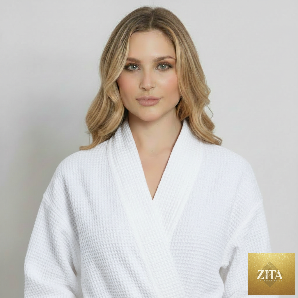 Front view of Lotus Linen women's knee-length waffle robe in white, showing textured fabric and relaxed fit.