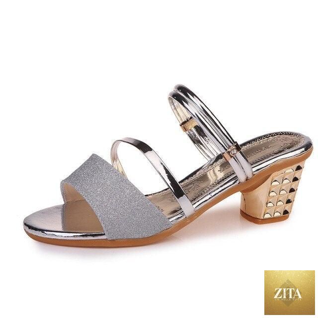 Gold women's summer open-toe sandals with ankle straps, low heels, and stylish design for dressy and party occasions.