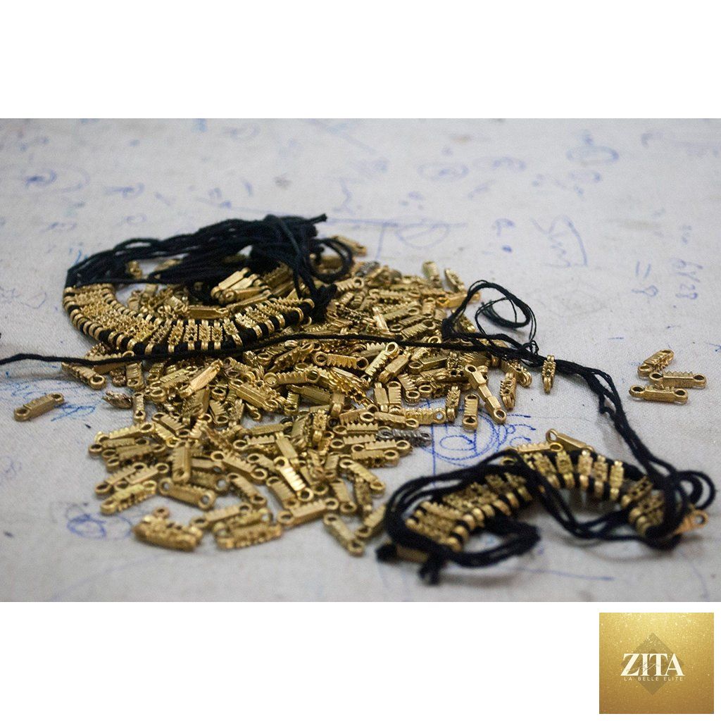 Gold zinc alloy boho tribal bib necklace with cotton tassels, handcrafted statement jewelry from BandsCo Straps.