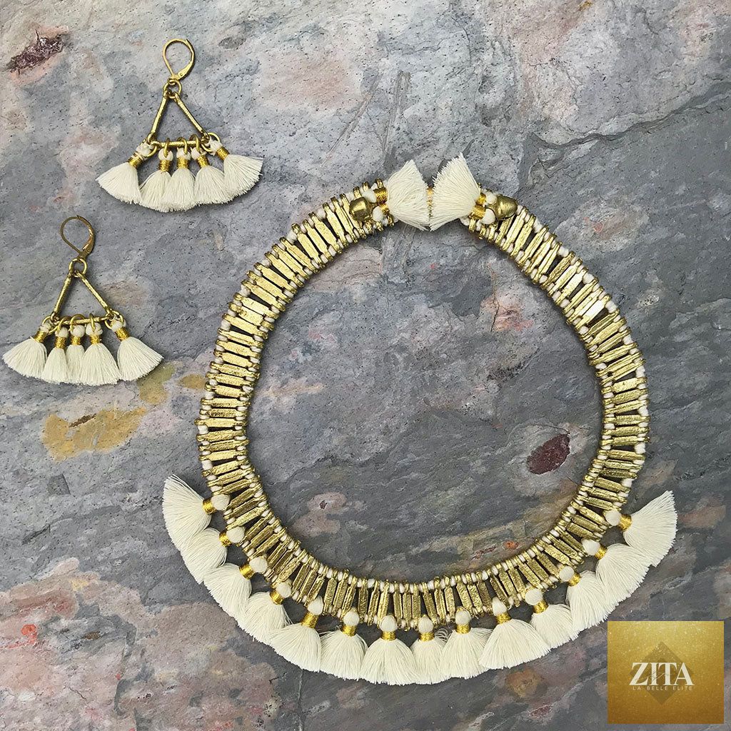 Handcrafted boho gold-accented tassel collar necklace with temple-inspired design and cotton tassels, perfect for statement jewelry.