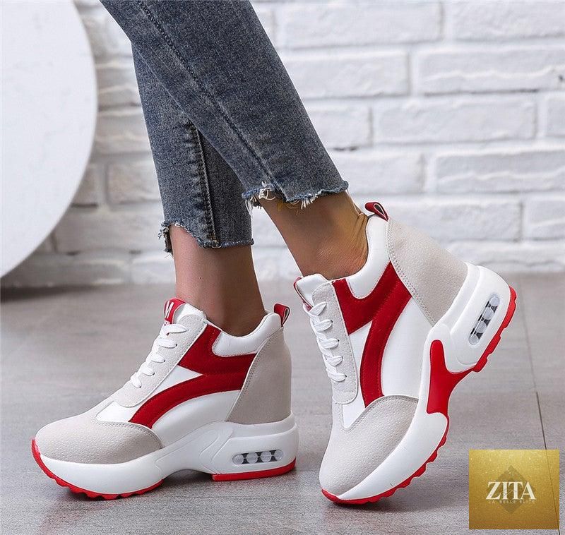 Red and black women's sneakers with air cushion, lace-up platform, leather accents, suitable for casual, athletic, and walking activities.