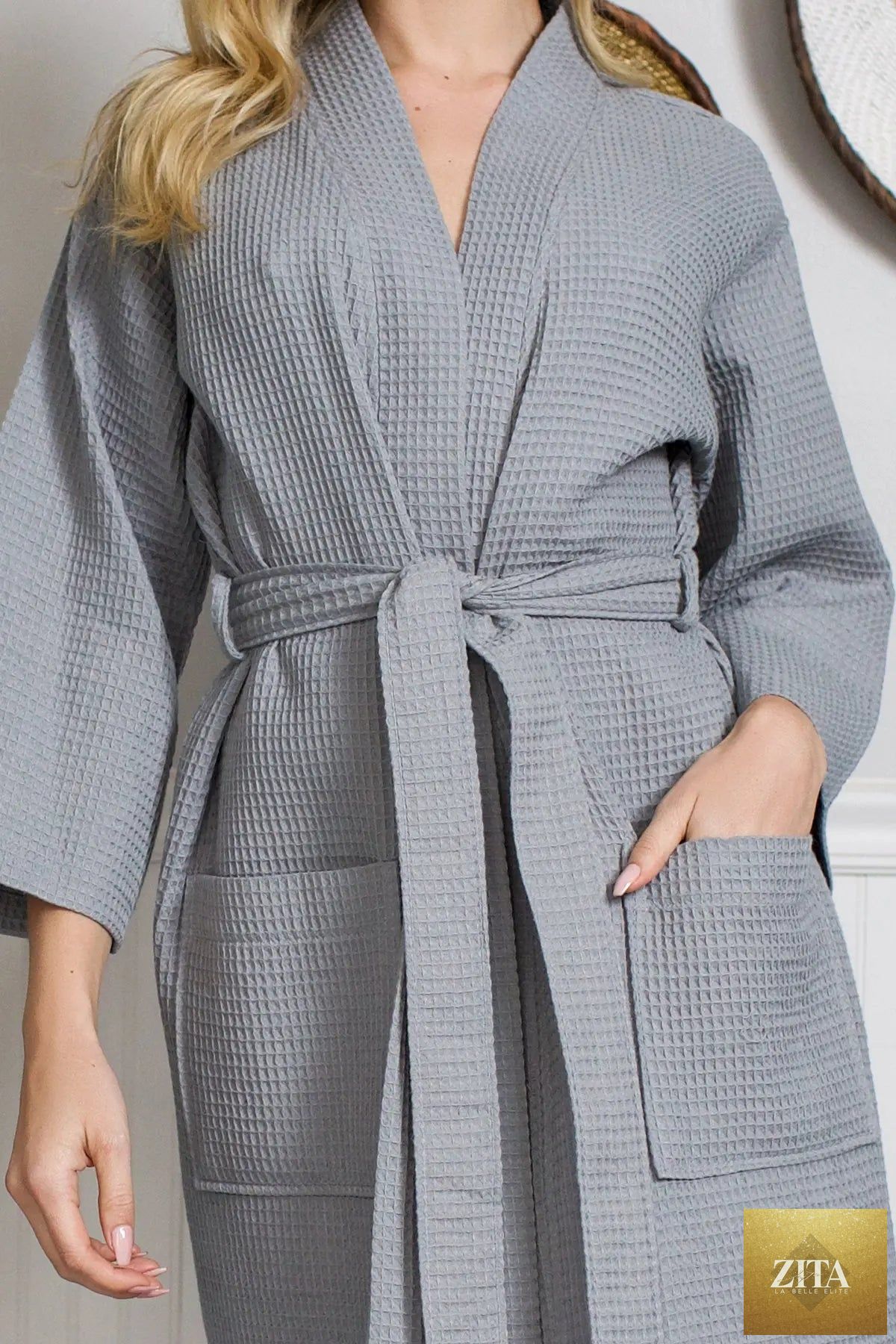 Knee-length waffle robe for women by Lotus Linen, featuring a cozy, textured fabric and a relaxed fit, ideal for lounging.