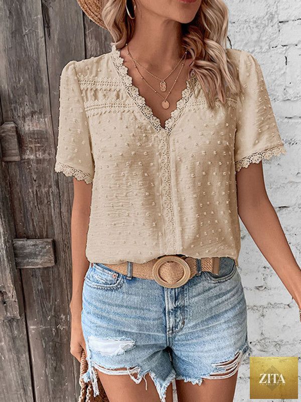 Lady Ros V-neck lace panel blouse showing short sleeves and elegant design in a close-up photo.