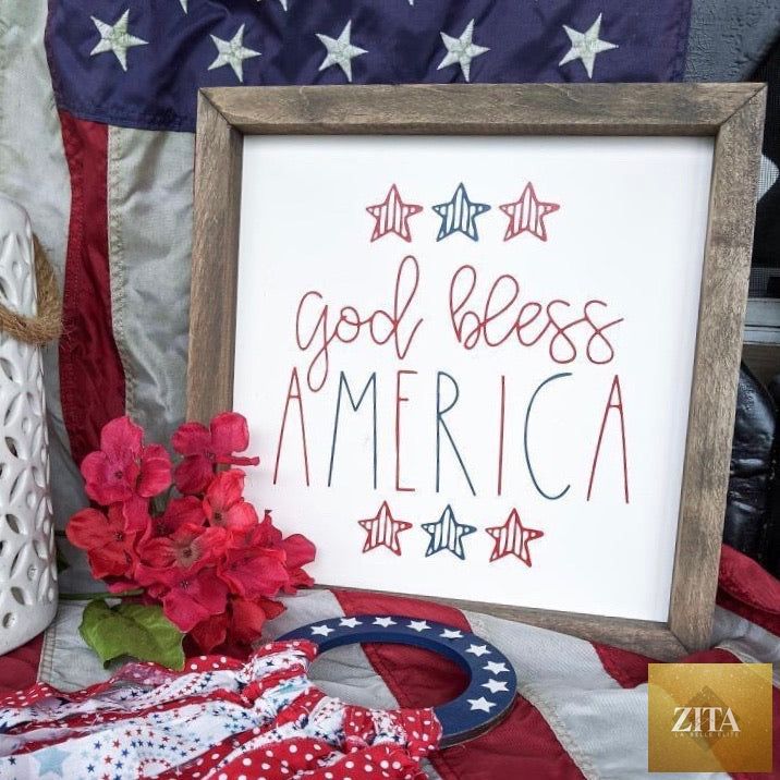 Framed art featuring "God Bless America" with red, white, and blue patriotic colors by Zita La Belle Elite.