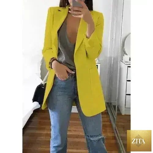 Femstylo women's casual slim blazer jacket with lapel, suitable for office and fashion, featured in a home and garden setting.