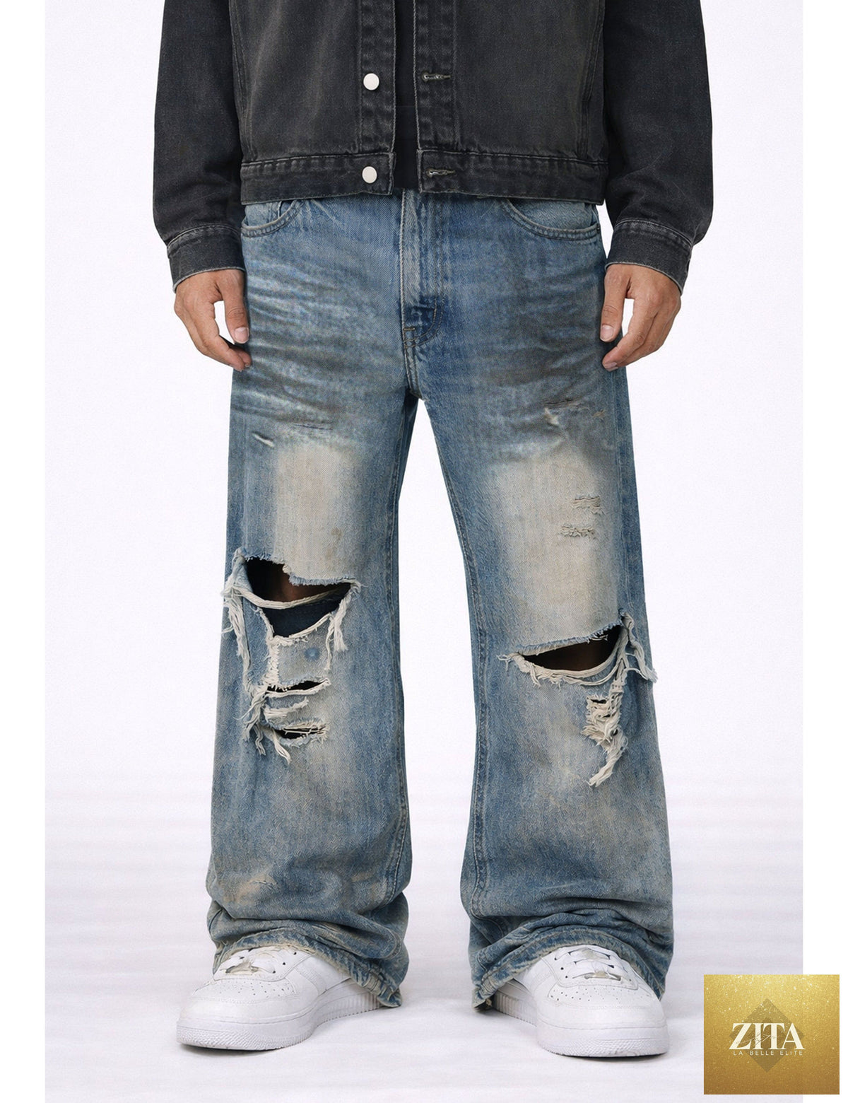 Pair of UNDEVELOPED Wideboy Destroyed Denim jeans with distressed details and relaxed fit, shown on a model.