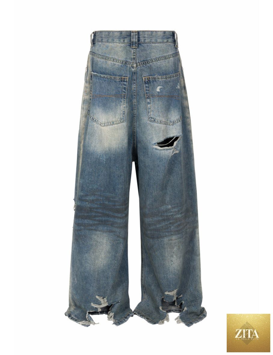 WIDEBOY Destroyed Denim jeans by UNDEVELOPED featuring distressed denim with ripped details and a relaxed fit.