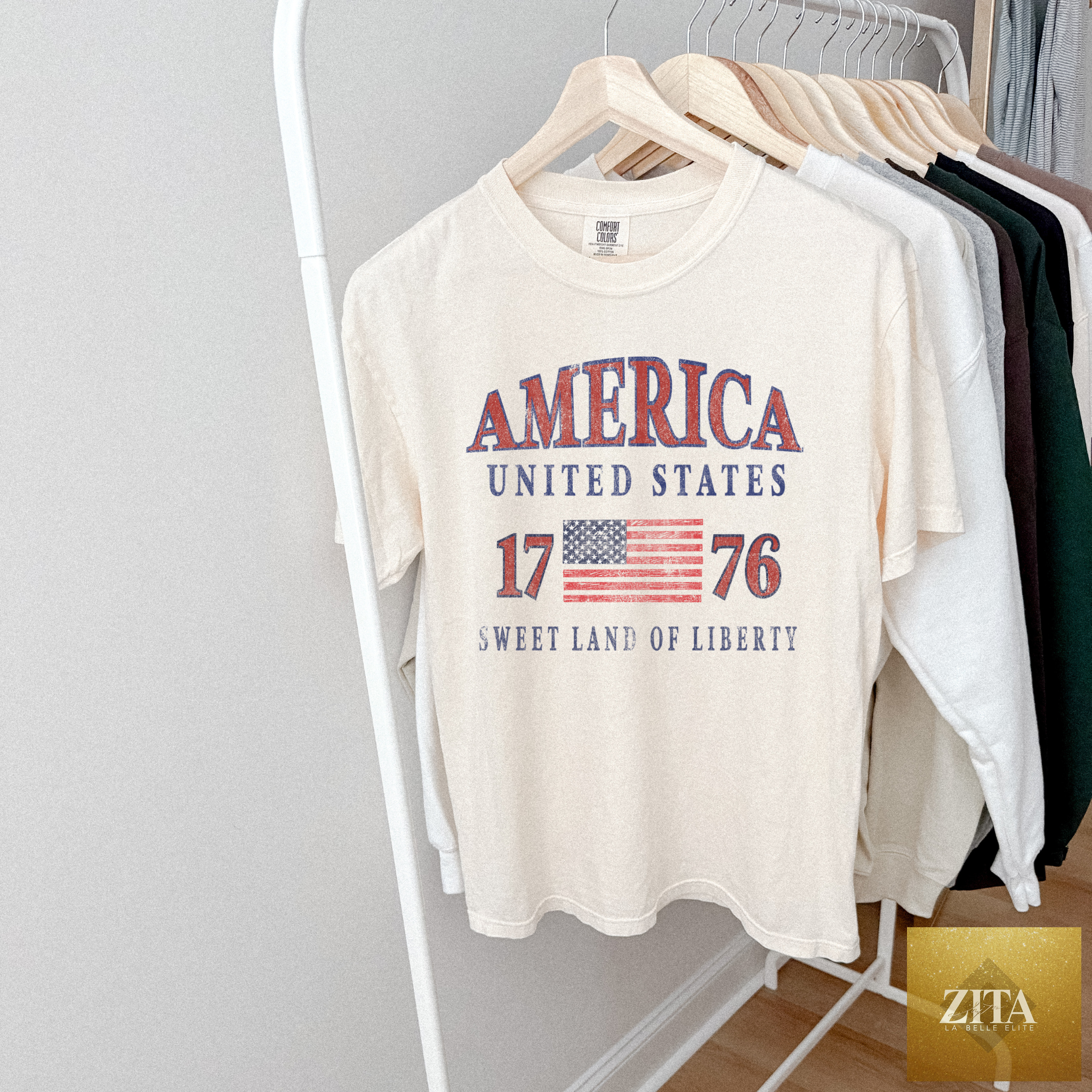 Ivory America 1776 graphic T-shirt by Hey Jude with patriotic USA design, featuring bold red, white, and blue print.