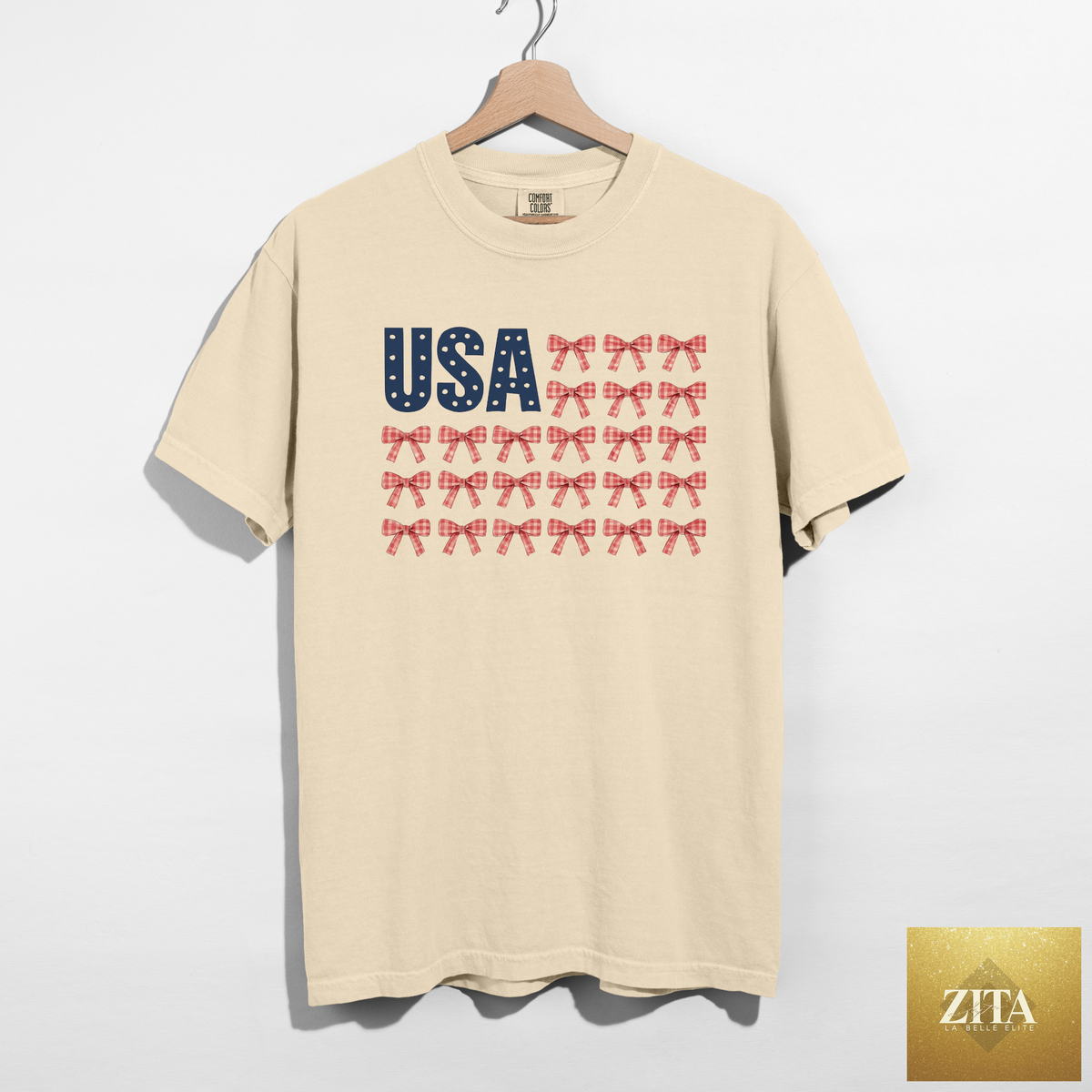 Ivory USA Bow Flag graphic t-shirt by Hey Jude Graphic Tees featuring patriotic gingham bows and American flag design.