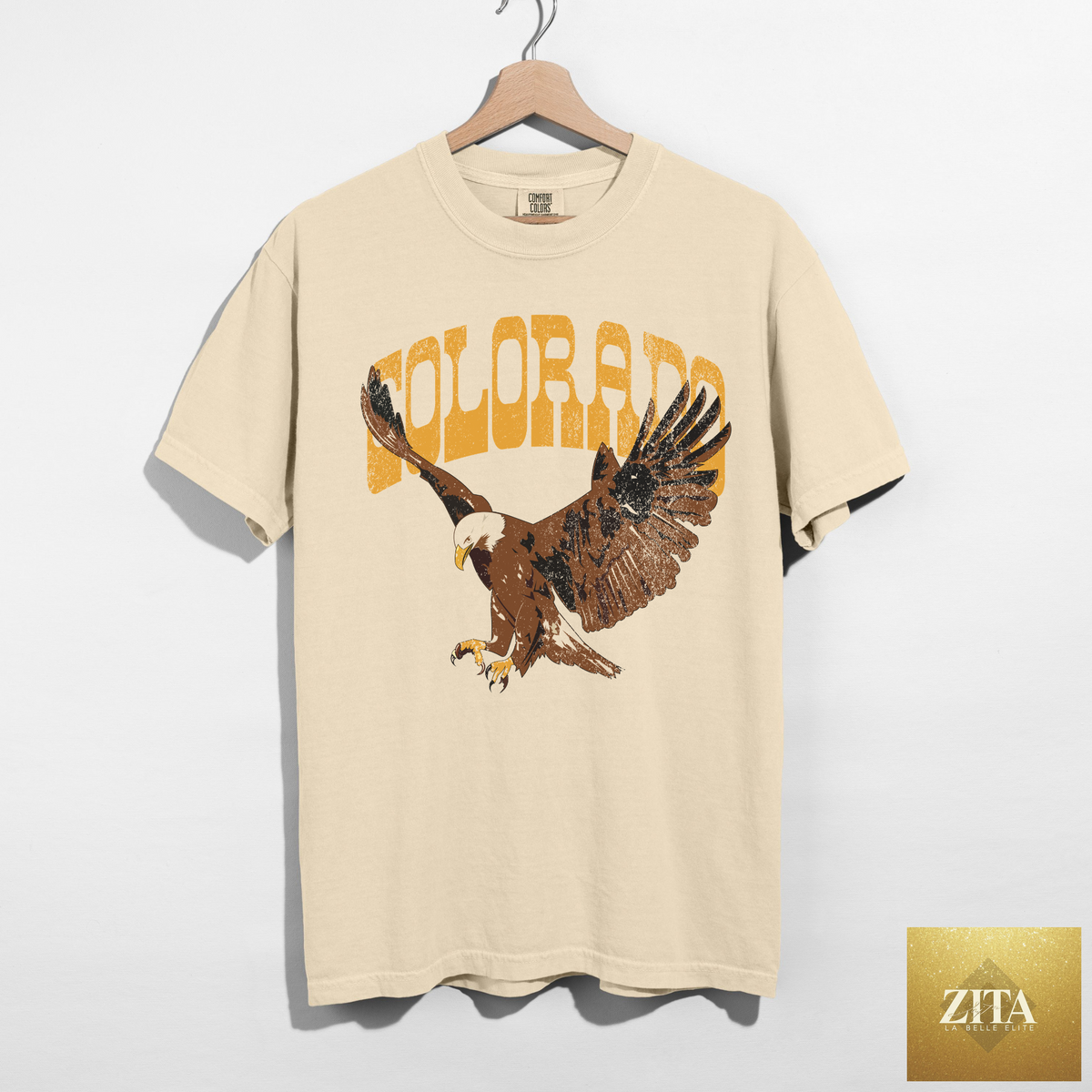Ivory Colorado Eagle graphic T-shirt by Hey Jude featuring vintage western style and Americana eagle design on Comfort Colors fabric.