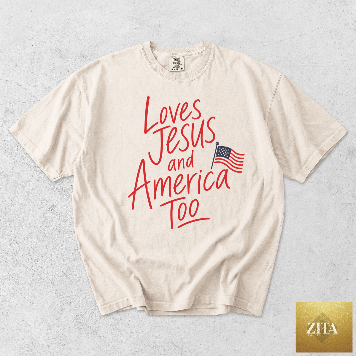 Ivory T-Shirt featuring a graphic design with the phrase "Loves Jesus and America Too" from Hey Jude Graphic Tees.