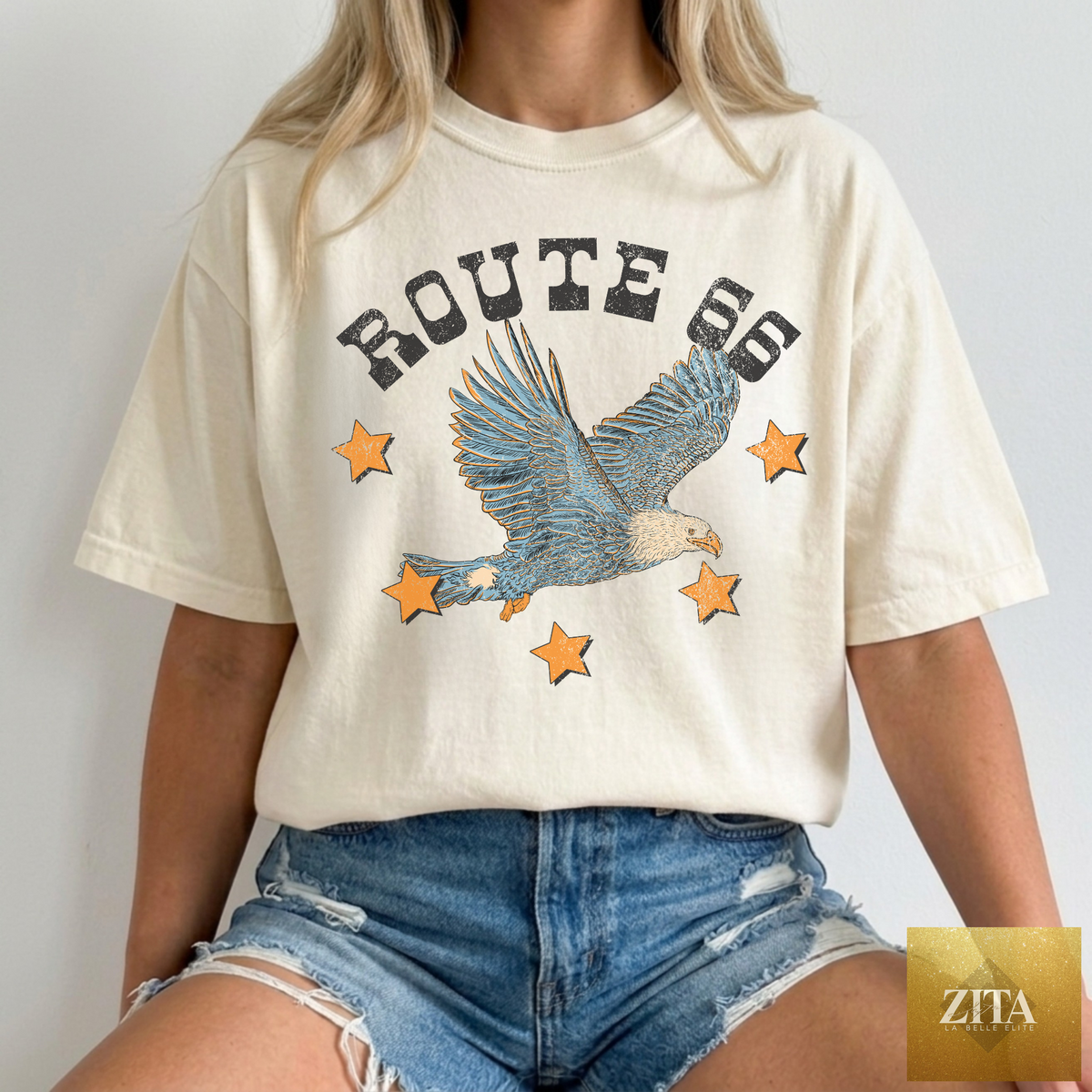 Ivory Route 66 Eagle graphic T-shirt by Hey Jude Graphic Tees featuring a retro western Route 66 design on soft fabric.