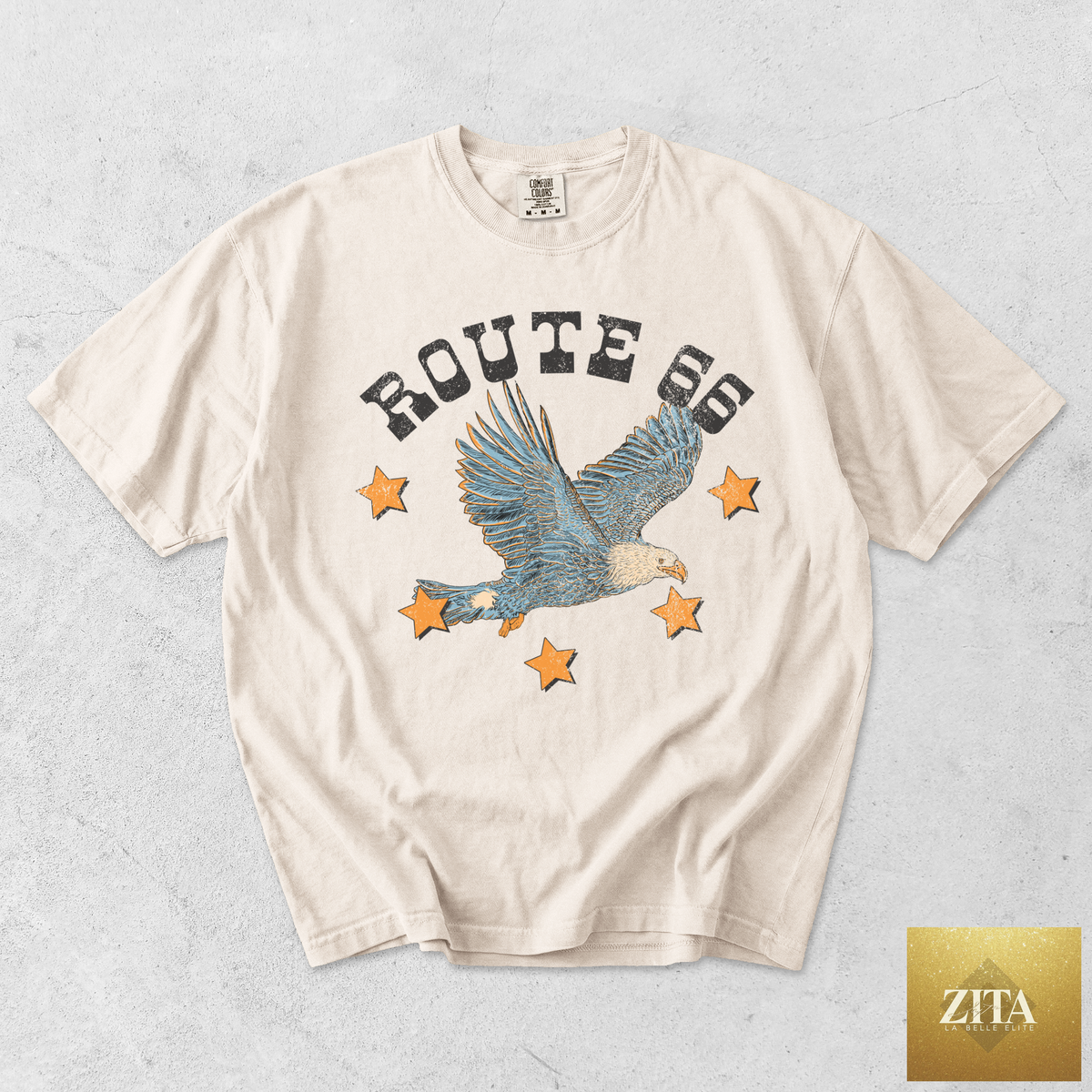 Ivory Route 66 Eagle graphic T-shirt by Hey Jude Graphic Tees featuring a retro Western eagle design.