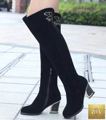 Embroidered high-heeled women’s fashion boots from Trendy Attic Store01 with thick sole and intricate embroidery details.