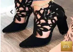 Pair of women's high-heeled sandals with thick heels from Trendy Attic Store01, featuring stylish straps and open toe design.