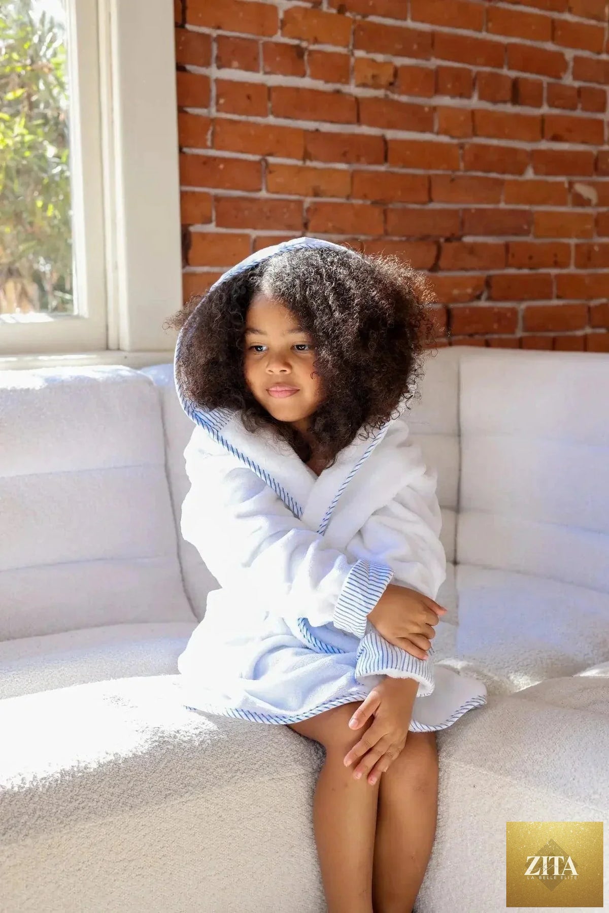 Kids plush robe by Lotus Linen, ultra-soft and cozy, designed for toddlers and kids, featuring a warm, comfortable fabric with a hood.