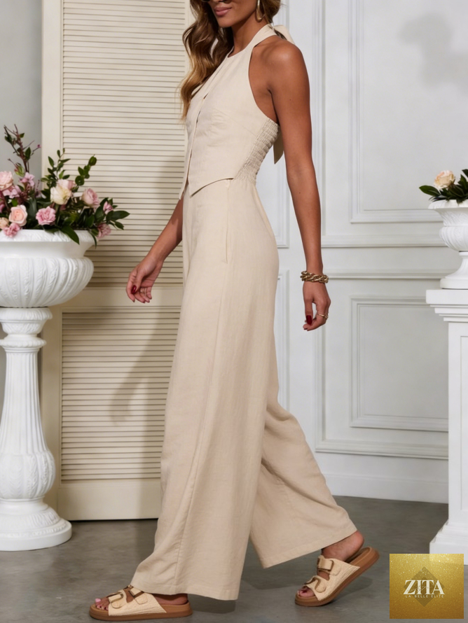 Linen vest wide-leg jumpsuit by SHOMICOBOUTIQUE featuring a relaxed fit, sleeveless design, and wide-leg trousers in light linen fabric.