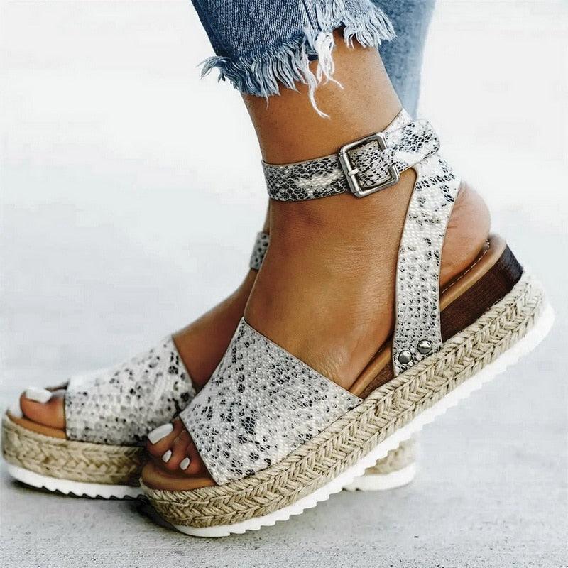 Stevvex ladies leopard high heel platform sandals with thick soles, adjustable straps, belt buckle, perfect for summer wear.