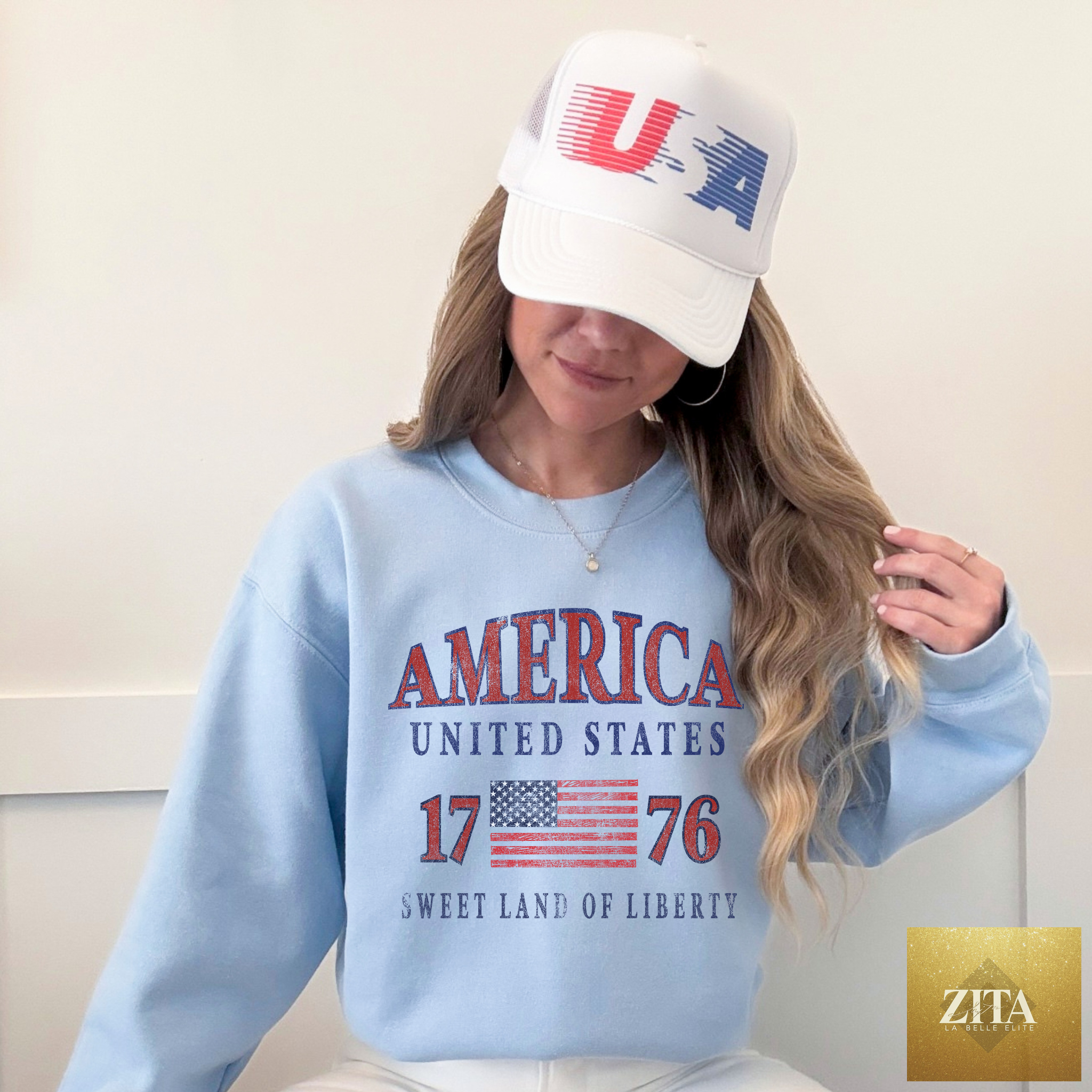 Light blue America United States 1776 crewneck sweatshirt with patriotic graphic, by Hey Jude Graphic Tees.