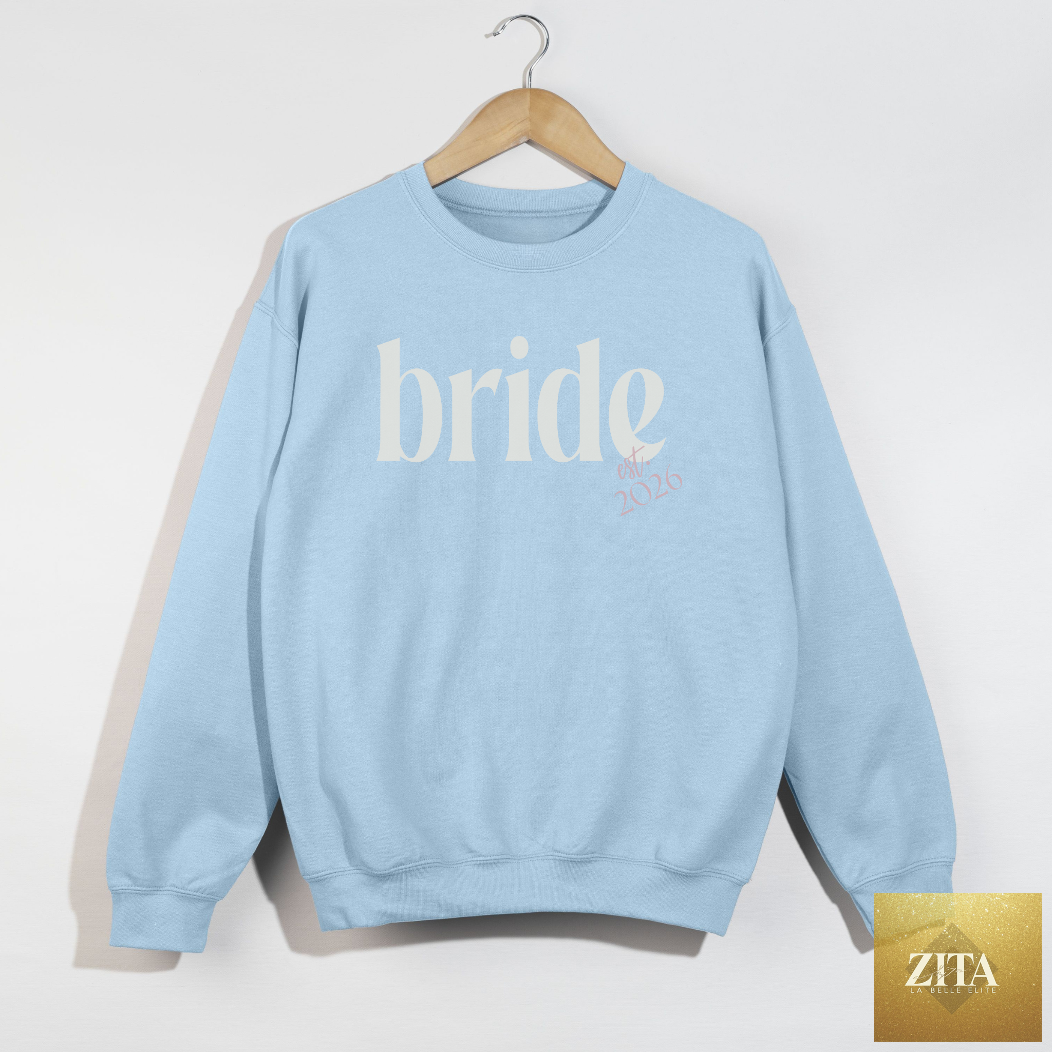 Light blue Bride Est. 2026 crewneck sweatshirt from Hey Jude Graphic Tees, perfect for bridal shower and bachelorette weekend outfits.