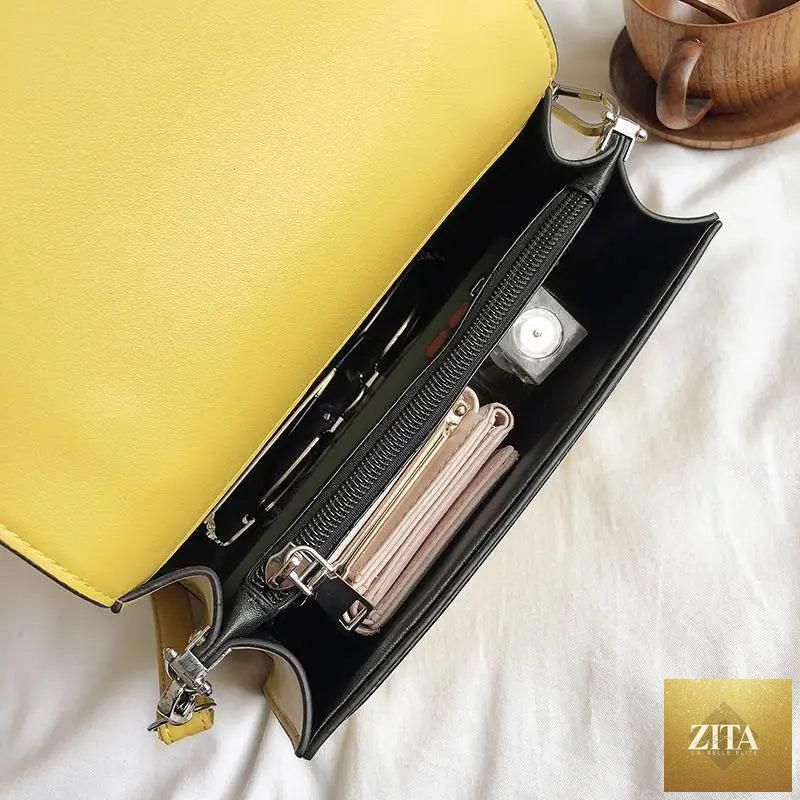 Elegant genuine leather women's handbag by Stevvex with large capacity, stylish design, and PU shoulder strap for versatile use.