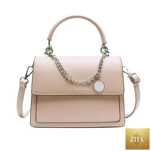 Elegant genuine leather women's handbag by Stevvex with large capacity, stylish design, and PU shoulder strap for versatile use.