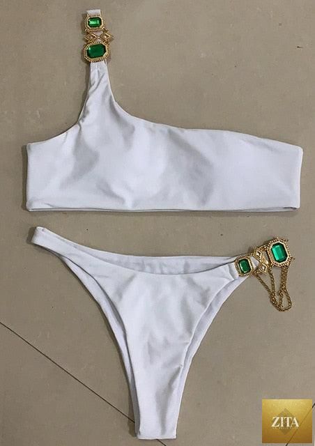 Luxury purple Stevvex bikini set featuring crystal rhinestones, halter neck, low waist, and tie side design for women’s swimwear.