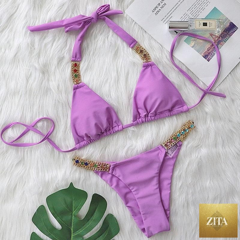 Luxury purple Stevvex bikini set with halter top, rhinestones, low waist, and tie-side bottoms, perfect for stylish women’s swimwear.