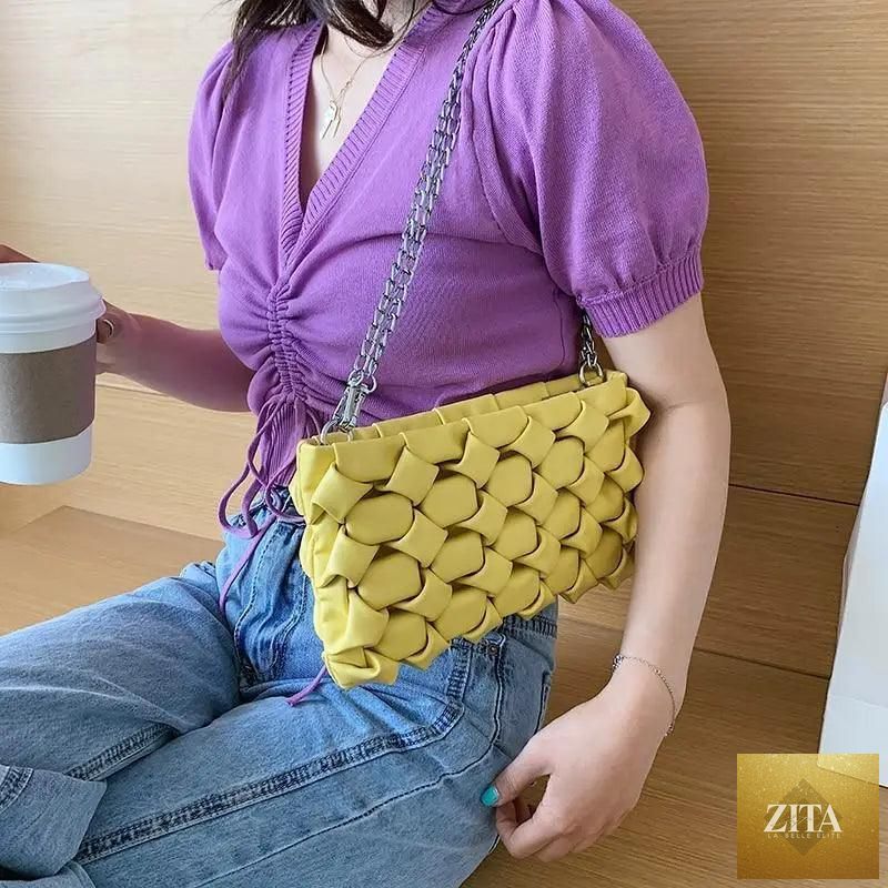 Elegant genuine leather Stevvex handbag with metal chain strap, showcasing a luxurious purse style for women and girls.