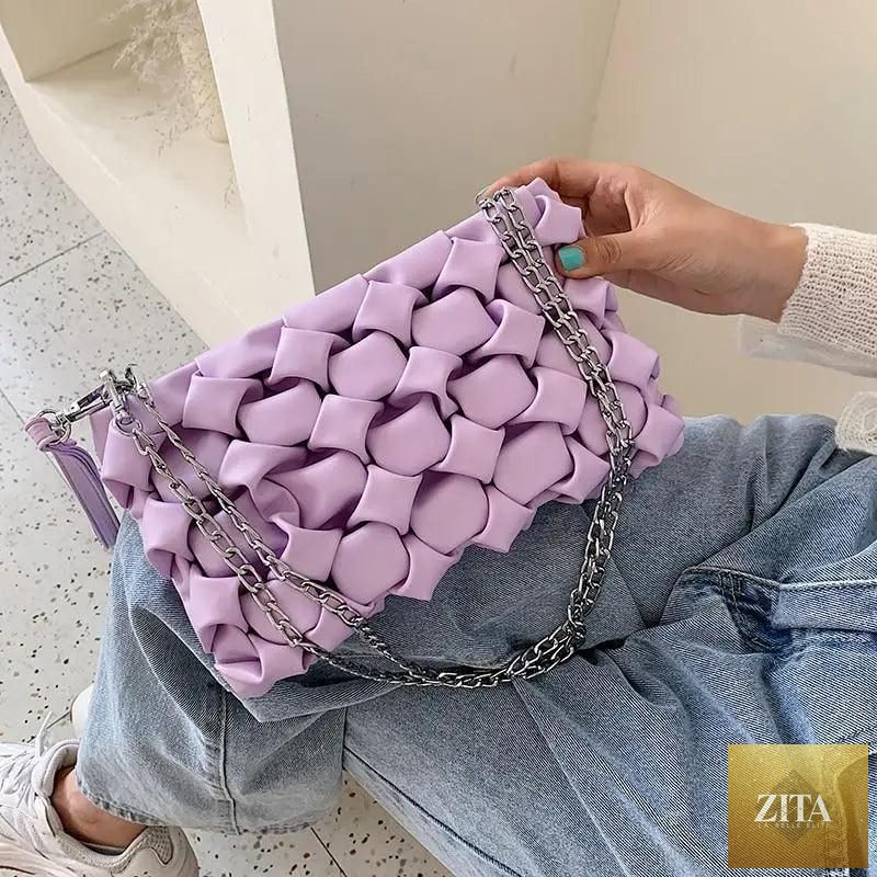 Elegant genuine leather Stevvex handbag with metal chain strap, designed for women and girls, featuring a versatile clutch and shoulder bag style.