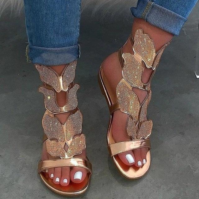 Stevvex women's rhinestone flat sandals with butterfly design, breathable, non-slip, casual outdoor beach shoes with jeweled accents.