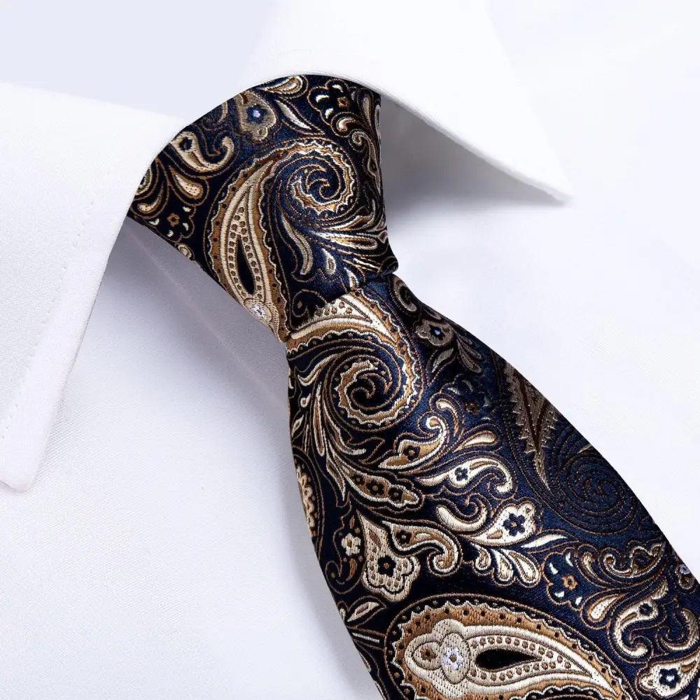 Luxury floral silk necktie, matching pocket square, and cufflinks set for men's wedding or formal attire by Stevvex.