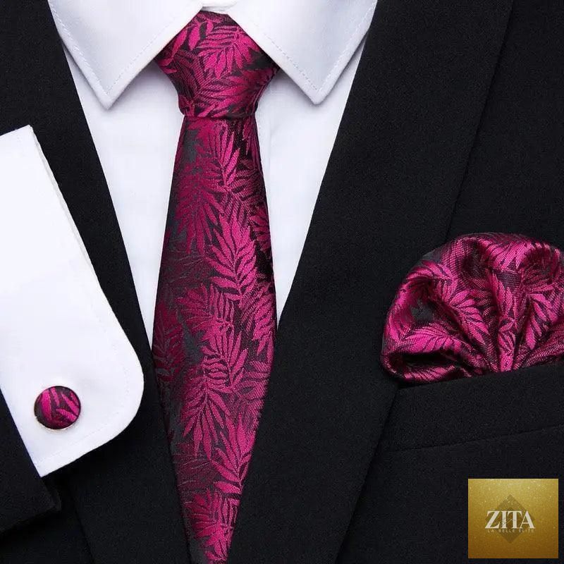 Men's elegant red silk tie with matching cufflinks and handkerchief, perfect for business or wedding suit attire.