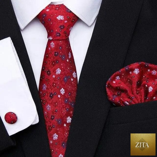 Men's elegant red silk necktie and cufflinks set with matching handkerchief, perfect for wedding or business suit outfits.