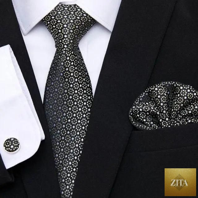 Men's elegant red silk tie with matching cufflinks and handkerchief, perfect for business or wedding suits.