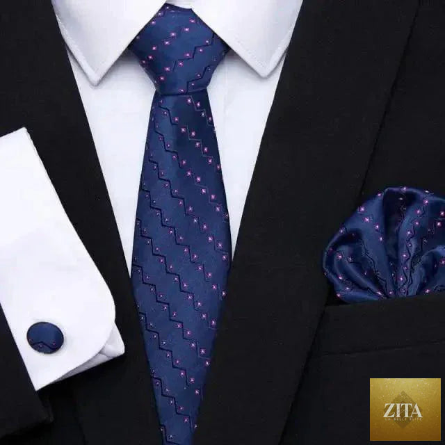 Men's elegant red silk tie with matching cufflinks and handkerchief, perfect for business or wedding suits by Stevvex.