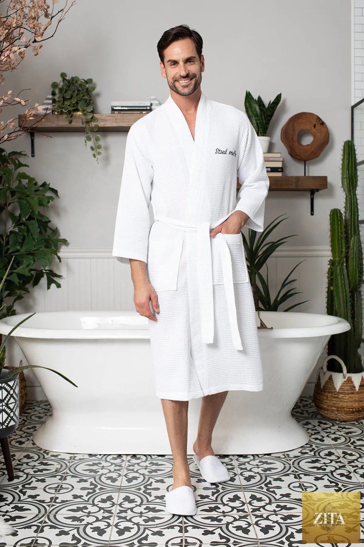 Absorbent, lightweight men's waffle spa bathrobe by Lotus Linen, shown hanging with a cozy, textured fabric design.