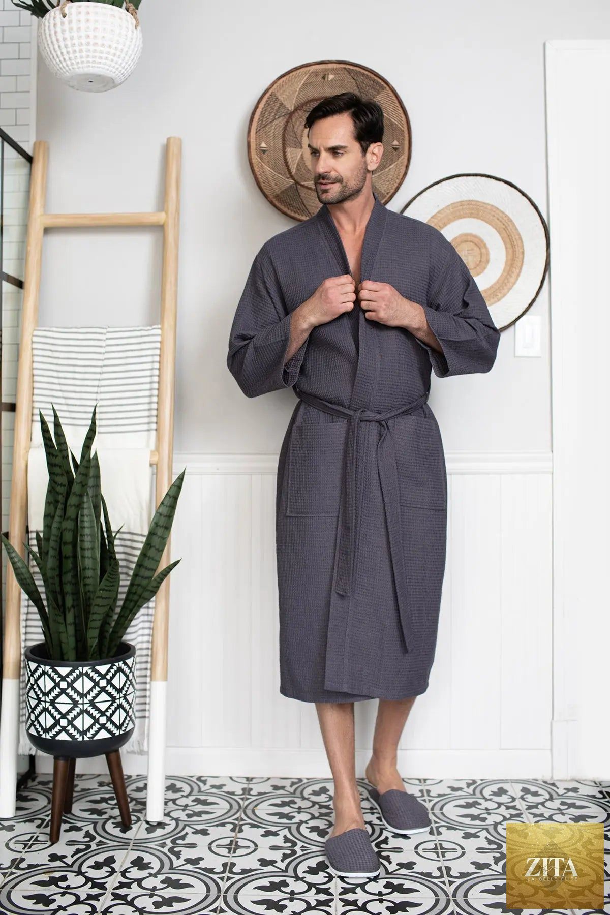 Men's waffle spa bathrobe by Lotus Linen, lightweight and absorbent, shown hanging on a hook with a relaxed fit and soft texture.